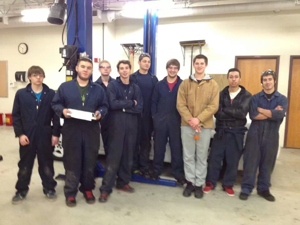 Autos 2 and Autos Seminar students celebrated their success fixing teachers cars on the last class day before winter break. From left to right, David Beekil, Tom Nelson, Craig Schmidt, Rich Mena, Jeff Voelker, Atticus Moreschi, David Glosson, Patrick Baker, Will Tibbitts  