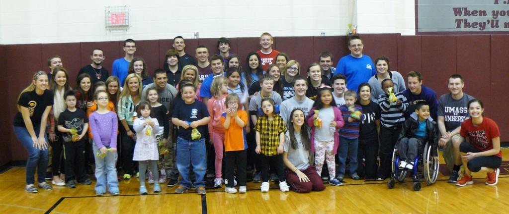 Seniors involved in the senior project pose with students from District 47 after a morning of games and play on April 9.