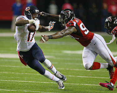 Chicago Bears wide receiver Alshon Jeffery makes a first down reception past Atlanta Falcons' Jonathan Massaquoi during the second half on Sunday, Oct. 12, 2014, at the Georgia Dome in Atlanta.