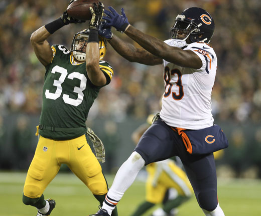 Green Bay Packers free safety Micah Hyde (33) intercepts the ball intended for Chicago Bears tight end Martellus Bennett (83) during the first quarter of their 55-14 loss on Sunday, Nov. 9, 2014 at Lambeau Field in Green Bay, Wis. 