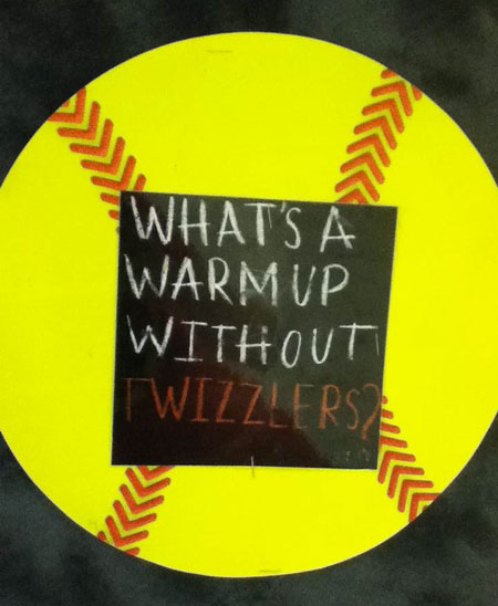 Whats a warm up without Twizzlers? asks this graphic on the 2015 softball bulletin board, demonstrating the sense of humor the coaches and team members enjoy.