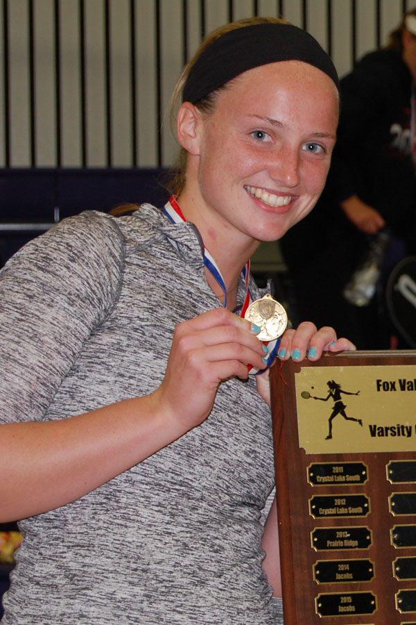 Annie Timm poses with the FVC Conference plaque after taking first place in No. 1 Singles.