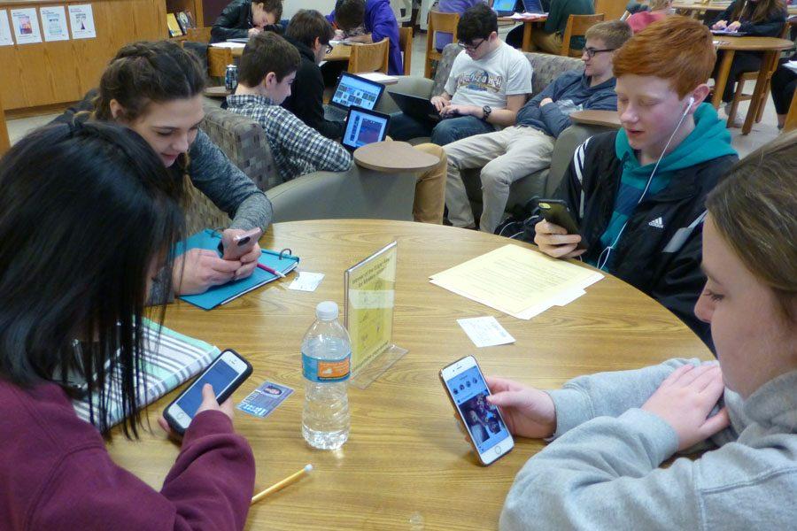  Students in the library check their phones constantly.