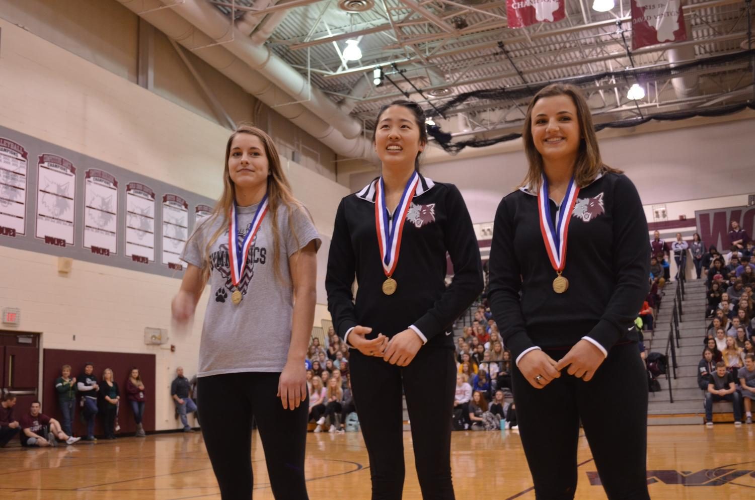 The+Girls+Gymnastics+Prairie+Ridge+Co-op+team+dominated+this+year+with+regional%2C+sectional%2C+and+now+a+second+state+championship.+Pictured+here+are+gymnasts+Erinn+Placko%2C+Maddi+Kim%2C+and+%0AKira+Karlblom.