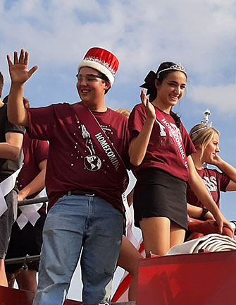 Anthony Carlini and Reanne Weil, Homecoming King and Queen, wave during the parade on September 20, 2019.
