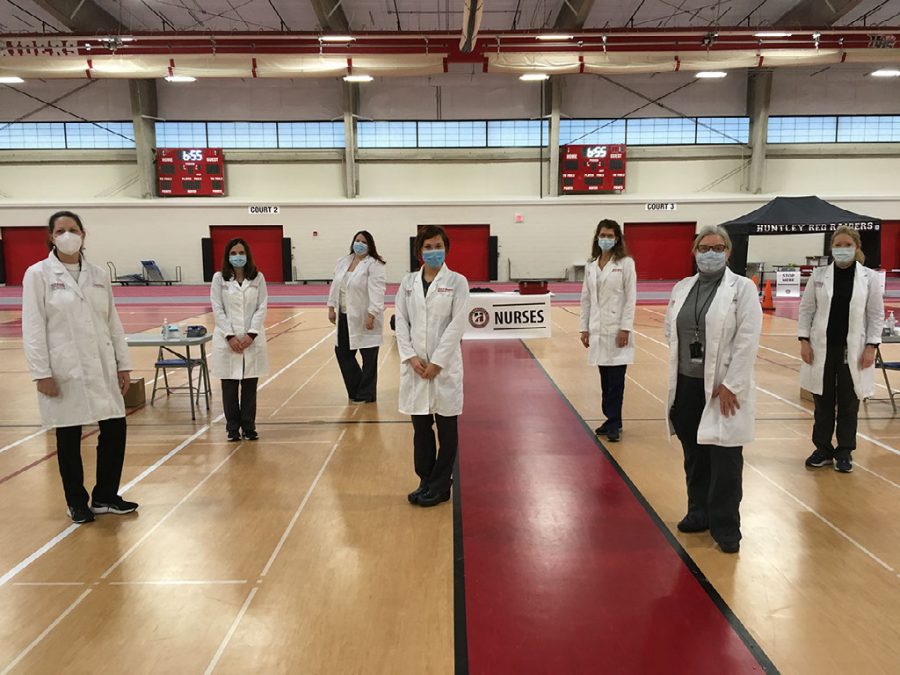 District 155 school nurses pose for a picture before the vaccination clinic on February 12, 2021 at Huntley High School.