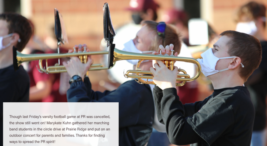 Seniors Kevin Riedl and Jeremy Abrams perform in an impromptu outdoor concert with the Wolfpack Marching Band led by new Director of Bands Marykate Kuhne, on Friday, April 16, 2021, when the varsity football game was cancelled due to the Jacobs High School teams quarantine.