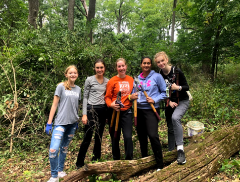 Members of the new Environmental Club pose for a picture during a Veteran Acres clean up day on September 4, 2021.