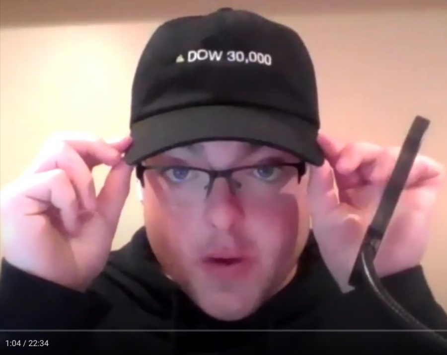 Senior+news+editor+Grant+Preves+describes+his+hat+that+says+DOW+30%2C000+during+the+September+26%2C+2021+recording+of+his+Financial+Festivities+podcast.