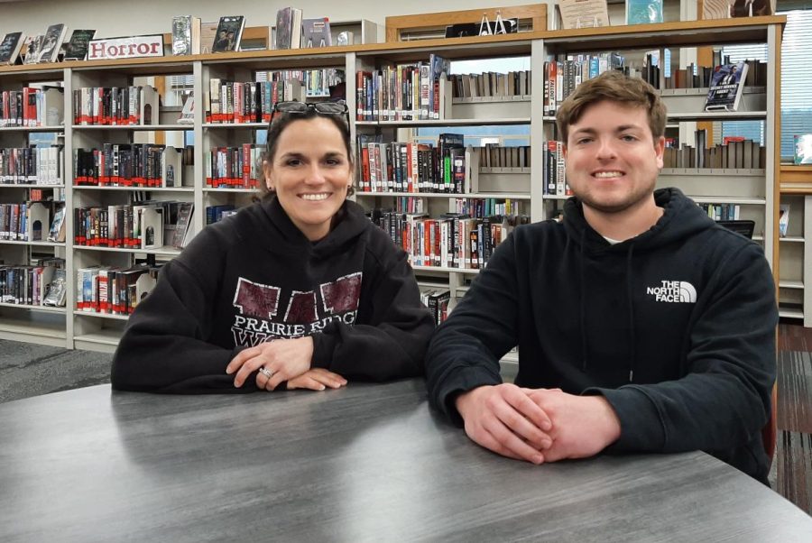 Wolf Prints senior news editor Grant Preves with Mrs. Bland, news team advisor, in the Prairie Ridge library on April 22, 2022.