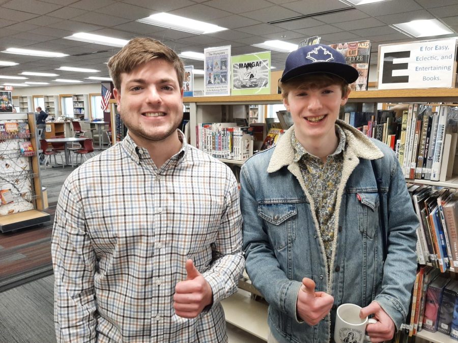 Seniors Grant Preves and Dimitri Vuyadinov pose for a picture after recording the Howl broadcast before school on April 12, 2022.