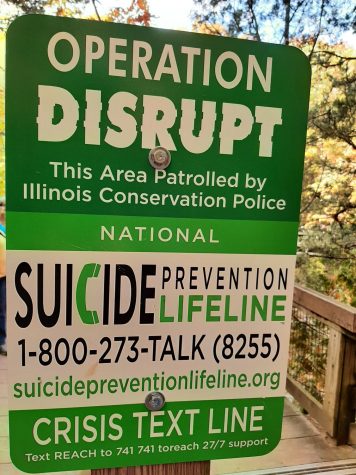 Visitors to Starved Rock State Park and other natural areas will see signs like this one for suicide prevention resources.