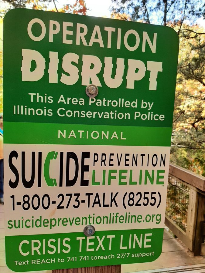 Visitors+to+Starved+Rock+State+Park+and+other+natural+areas+will+see+signs+like+this+one+for+suicide+prevention+resources.
