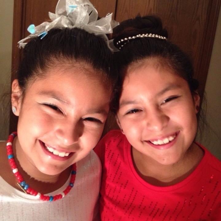 Jazzmyn Prado and Deborah Prado dressed in patriotic clothes on the 4th of July one summer night during their childhood.