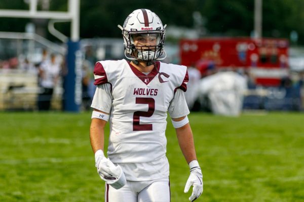 Logan Thennes played offense and defense against Cary-Grove on August 29, 2025 in the Wolves 34-21 victory. 
Photo Credit: DJ Farstead